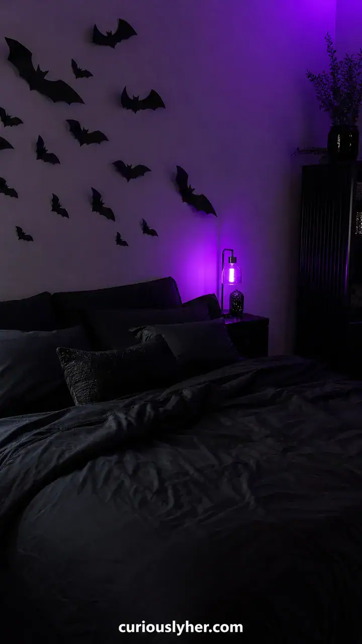 10. A Bat Cave Trunk With Black Bedsheets, Paper Bats, And One Purple Light