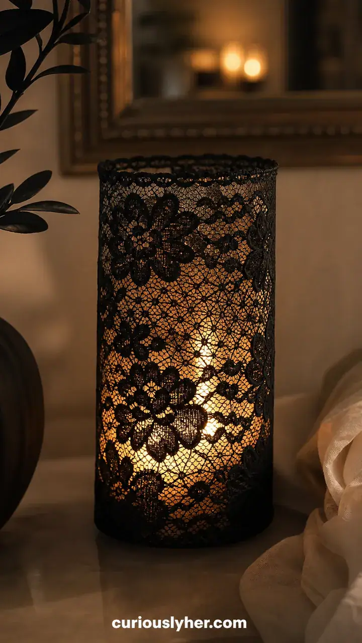 3. A Dollar Store Glass Vase Wrapped In Black Lace With A Candle Glowing Inside